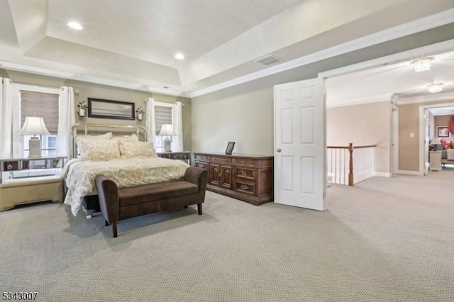 bedroom featuring visible vents, recessed lighting, ornamental molding, light carpet, and a raised ceiling