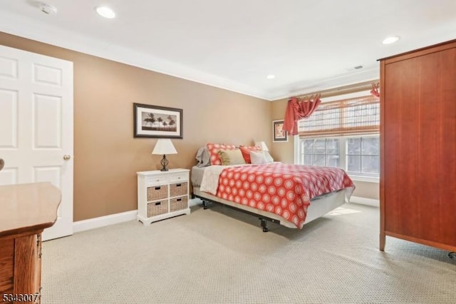 bedroom with recessed lighting, light colored carpet, and baseboards