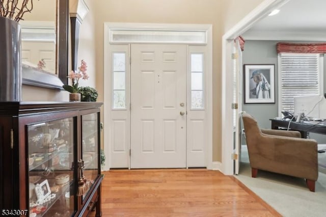 foyer entrance with light wood-style flooring