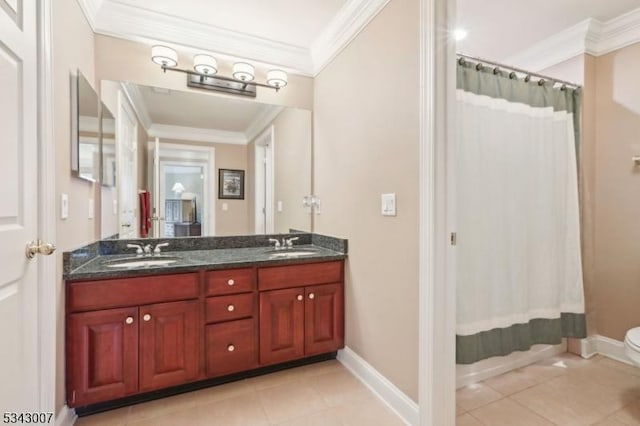 full bathroom with toilet, double vanity, ornamental molding, and a sink