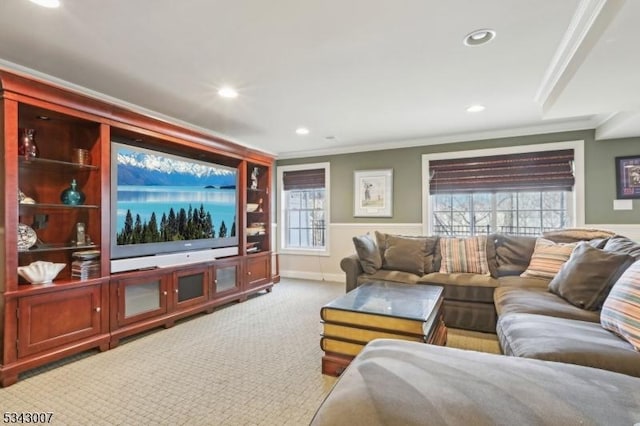 carpeted living room with recessed lighting and crown molding