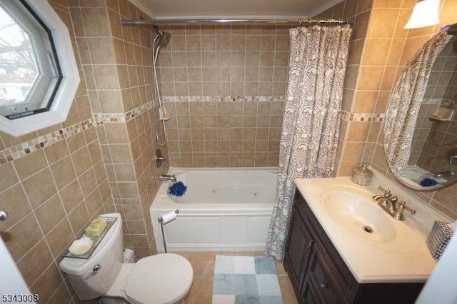 bathroom with vanity, tile walls, toilet, and shower / bathtub combination with curtain