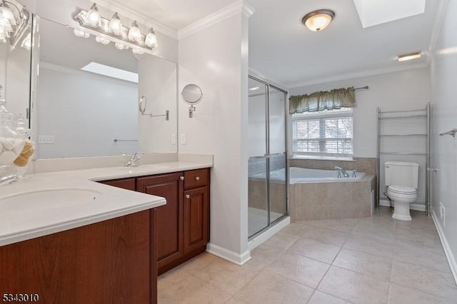 full bath featuring a shower stall, a skylight, vanity, and ornamental molding