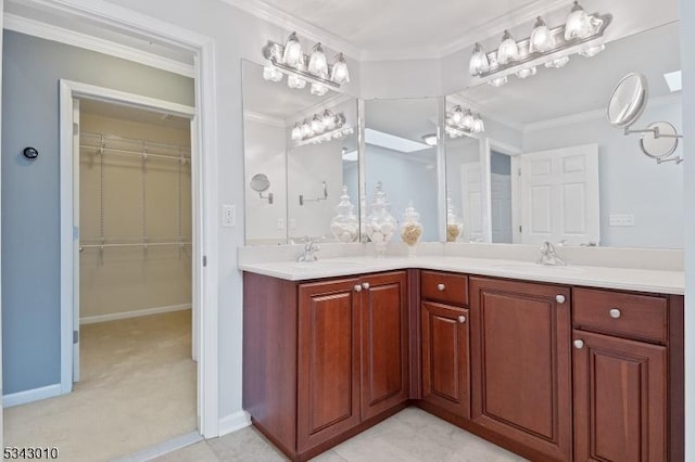 full bath featuring crown molding, double vanity, and a sink