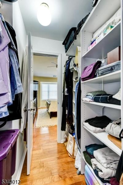 spacious closet with light wood-style floors