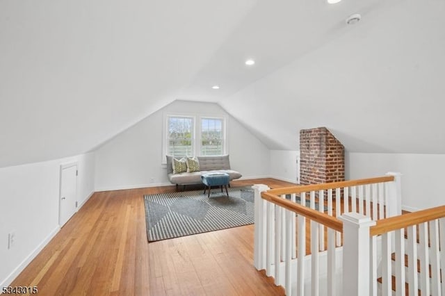 bonus room featuring lofted ceiling, recessed lighting, wood finished floors, and baseboards