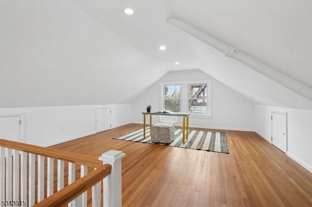 additional living space with vaulted ceiling, recessed lighting, baseboards, and wood-type flooring