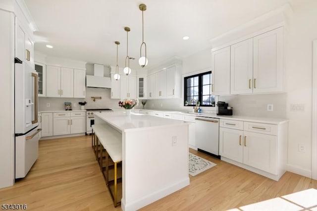 kitchen with custom range hood, white appliances, white cabinets, light countertops, and glass insert cabinets