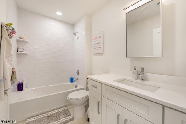 bathroom featuring vanity, toilet, and washtub / shower combination