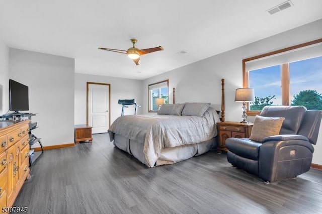 bedroom featuring visible vents, baseboards, a ceiling fan, and wood finished floors