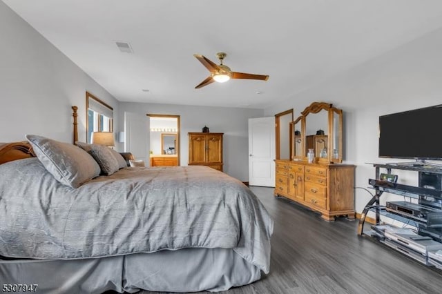 bedroom featuring visible vents, dark wood finished floors, and a ceiling fan