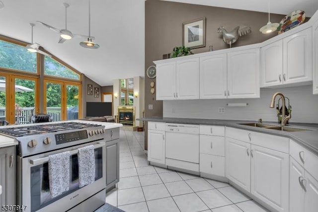 kitchen featuring a sink, gas range, lofted ceiling, and dishwasher