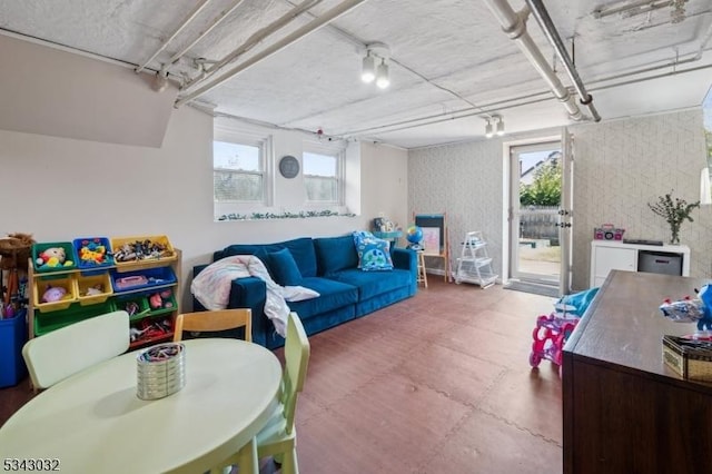 living area featuring wallpapered walls