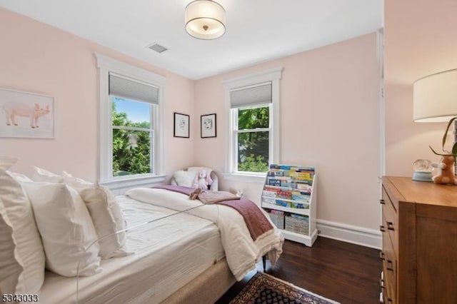 22 Salter Pl, Maplewood Twp, NJ 07040 - bedroom with multiple windows, dark wood finished floors, and baseboards