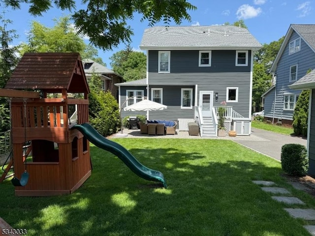 22 Salter Pl, Maplewood Twp, NJ 07040 - rear view of house featuring a playground, an outdoor hangout area, and a yard