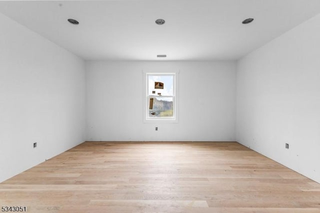 empty room featuring wood finished floors