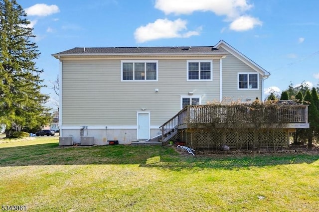 back of house featuring a deck, cooling unit, stairs, and a yard