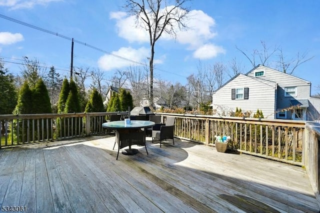 deck with outdoor dining space