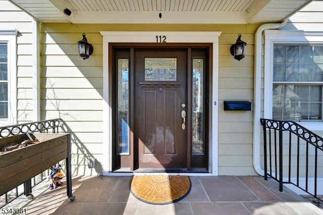 property entrance featuring covered porch