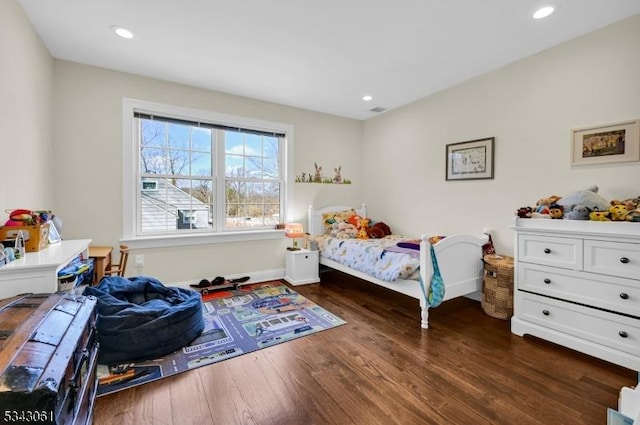 bedroom with dark wood finished floors, visible vents, recessed lighting, and baseboards