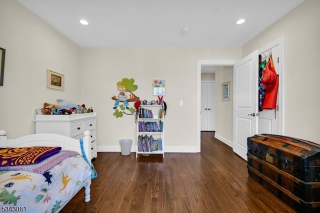 bedroom featuring recessed lighting, wood finished floors, and baseboards