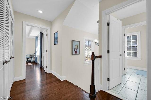 hallway featuring recessed lighting, wood finished floors, and baseboards