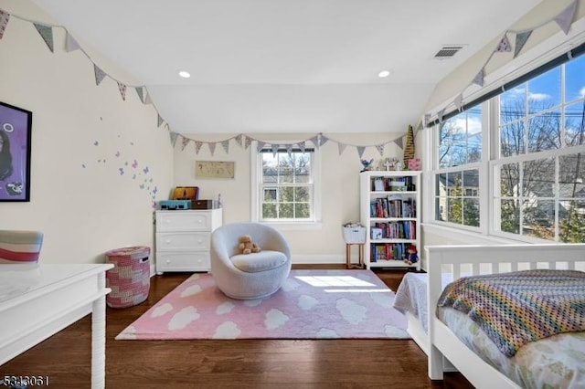 bedroom featuring visible vents, wood finished floors, recessed lighting, baseboards, and lofted ceiling