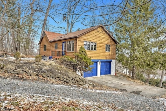 view of front of property with concrete driveway and an attached garage