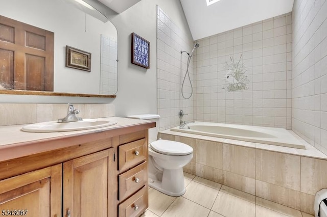 bathroom featuring toilet, tiled shower / bath combo, tile patterned flooring, vanity, and vaulted ceiling