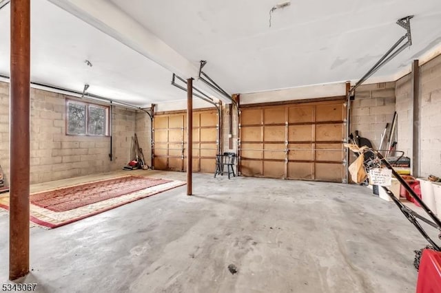 garage with concrete block wall