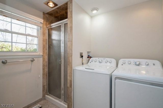 laundry room with laundry area and washing machine and clothes dryer