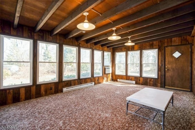 sunroom / solarium with a baseboard heating unit, beamed ceiling, and a healthy amount of sunlight