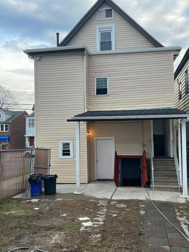 exterior space featuring a patio area, entry steps, and fence