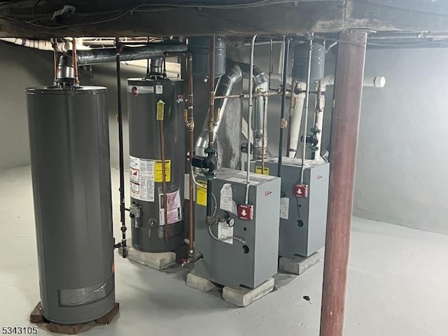 utility room featuring gas water heater