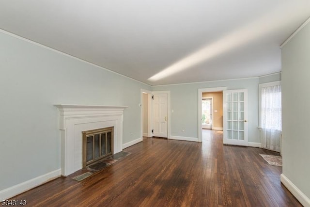 unfurnished living room with crown molding, a fireplace with flush hearth, wood finished floors, and baseboards