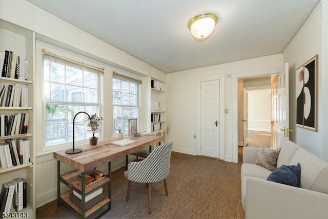 home office featuring wood finished floors and baseboards