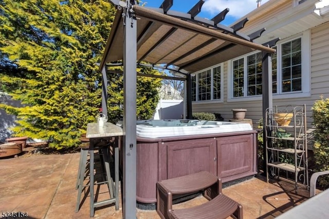 view of patio with a hot tub