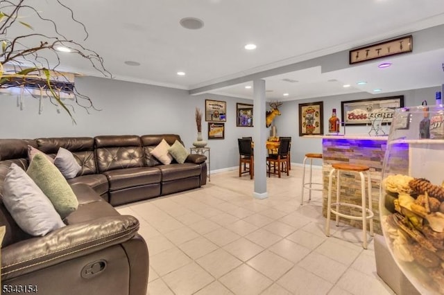 living room with recessed lighting, baseboards, crown molding, and light tile patterned floors