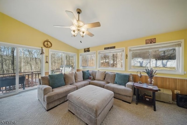 sunroom / solarium with ceiling fan and vaulted ceiling