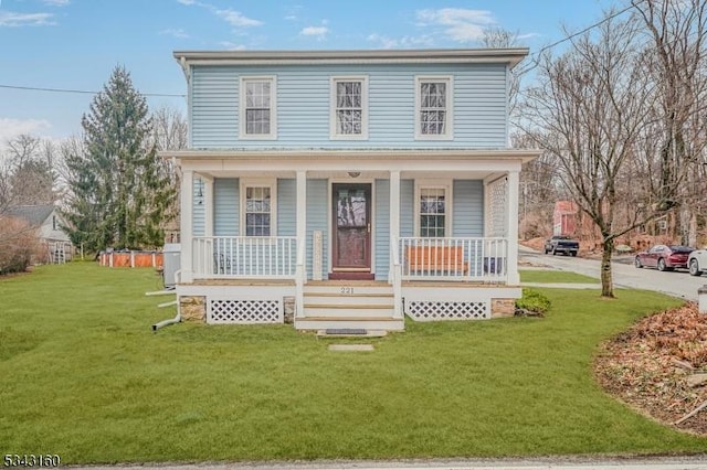 view of front of home featuring covered porch and a front yard