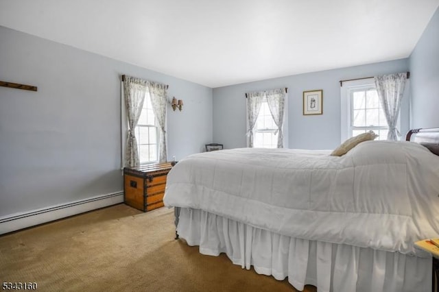 carpeted bedroom with multiple windows and a baseboard radiator