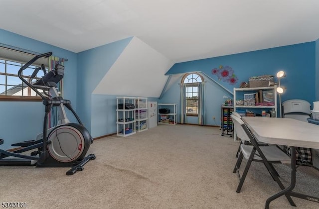 office featuring lofted ceiling, baseboards, and carpet floors