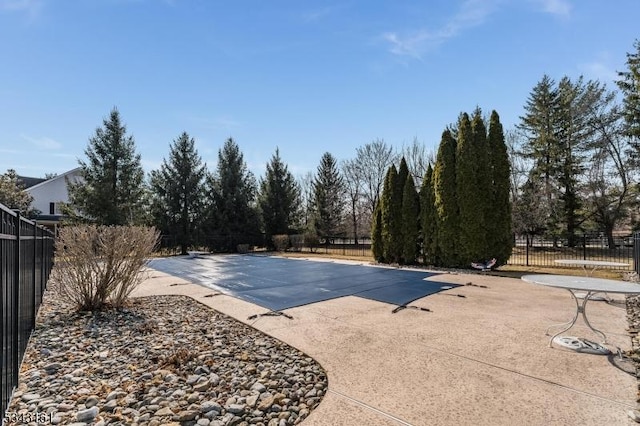 view of pool featuring a fenced in pool, a patio, and fence