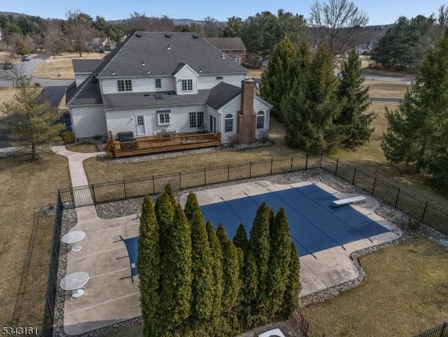 view of pool with a fenced in pool, fence, a wooden deck, a yard, and a patio area