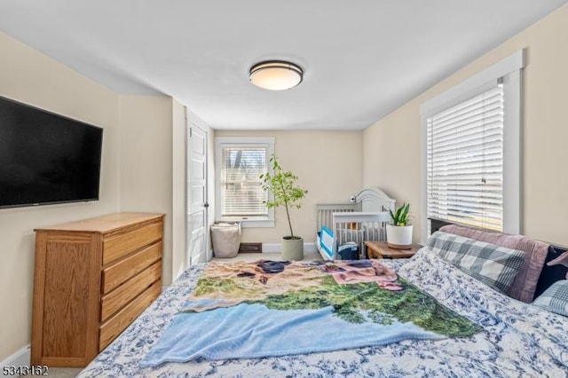 bedroom featuring baseboards