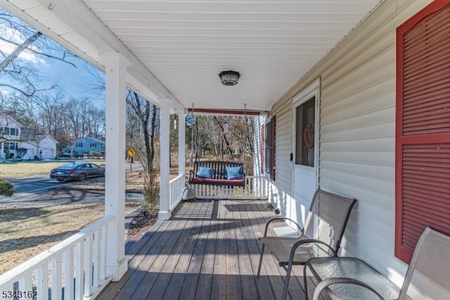 wooden terrace with a porch