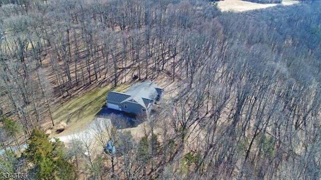 bird's eye view featuring a forest view