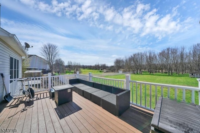 wooden terrace featuring a yard and an outdoor hangout area