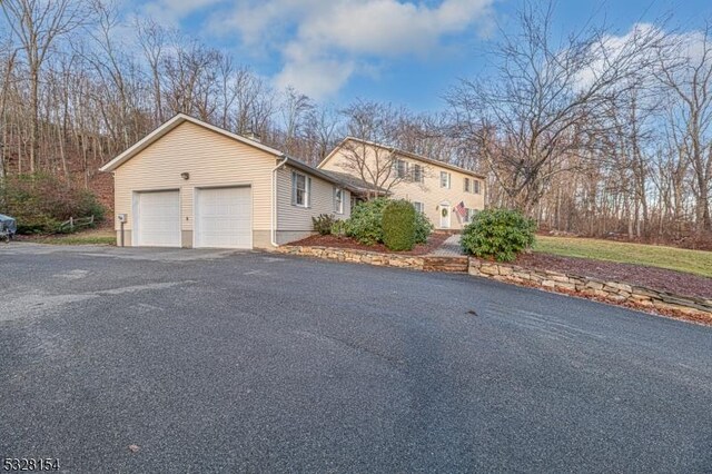 view of side of home with driveway