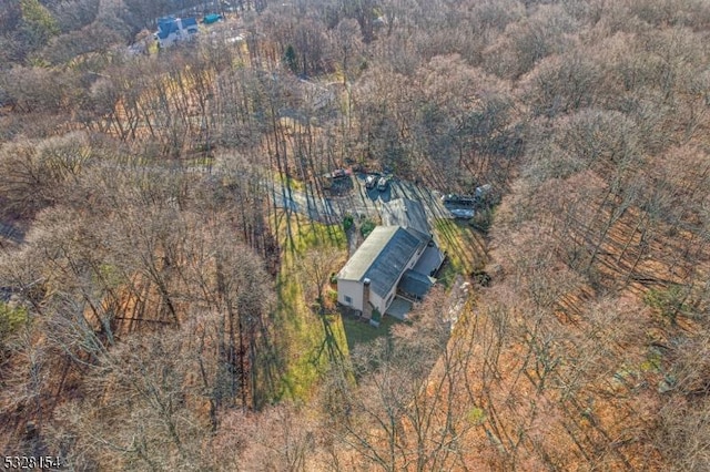 drone / aerial view with a view of trees
